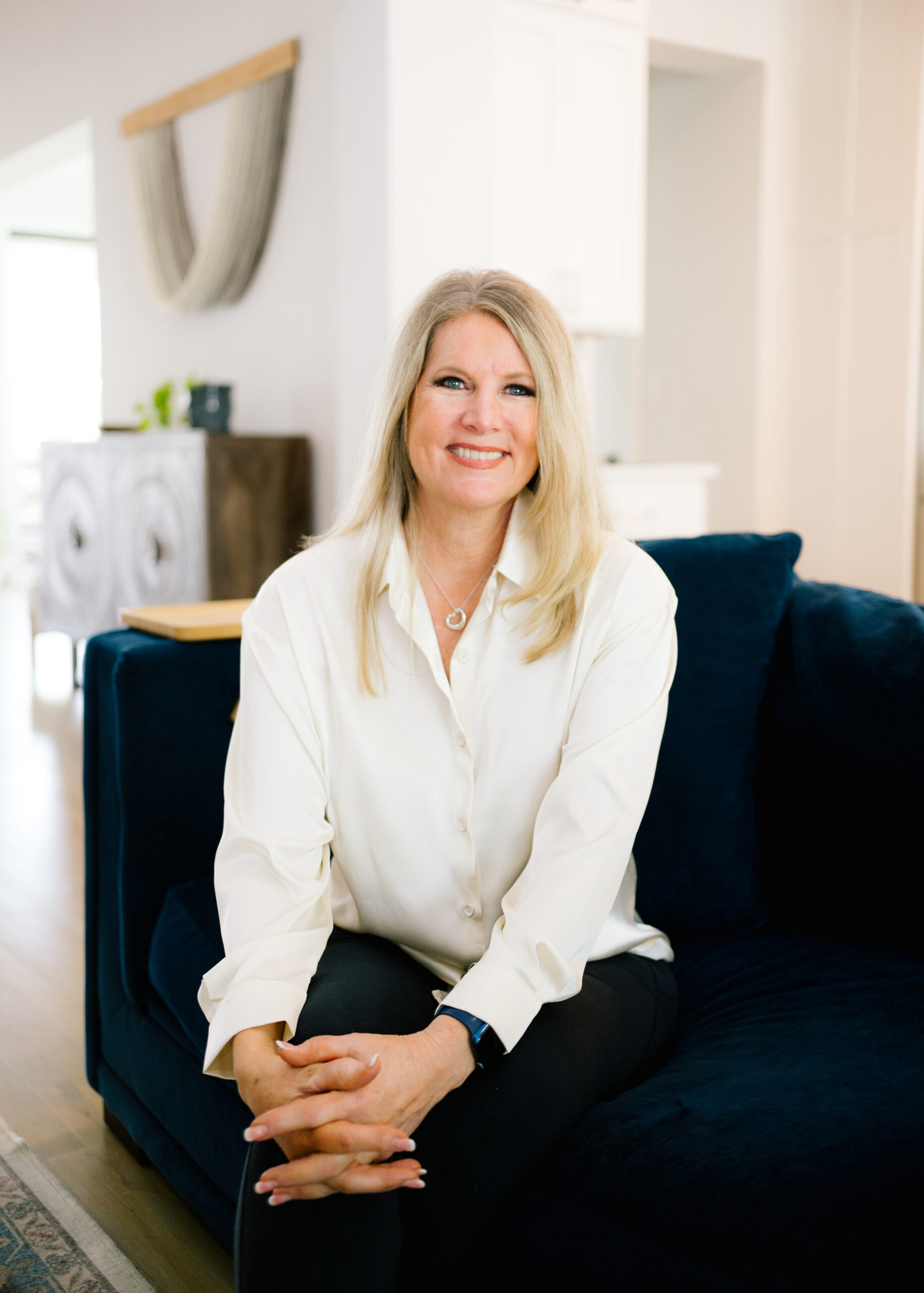 Dr. Victorya Rogers seated on a couch